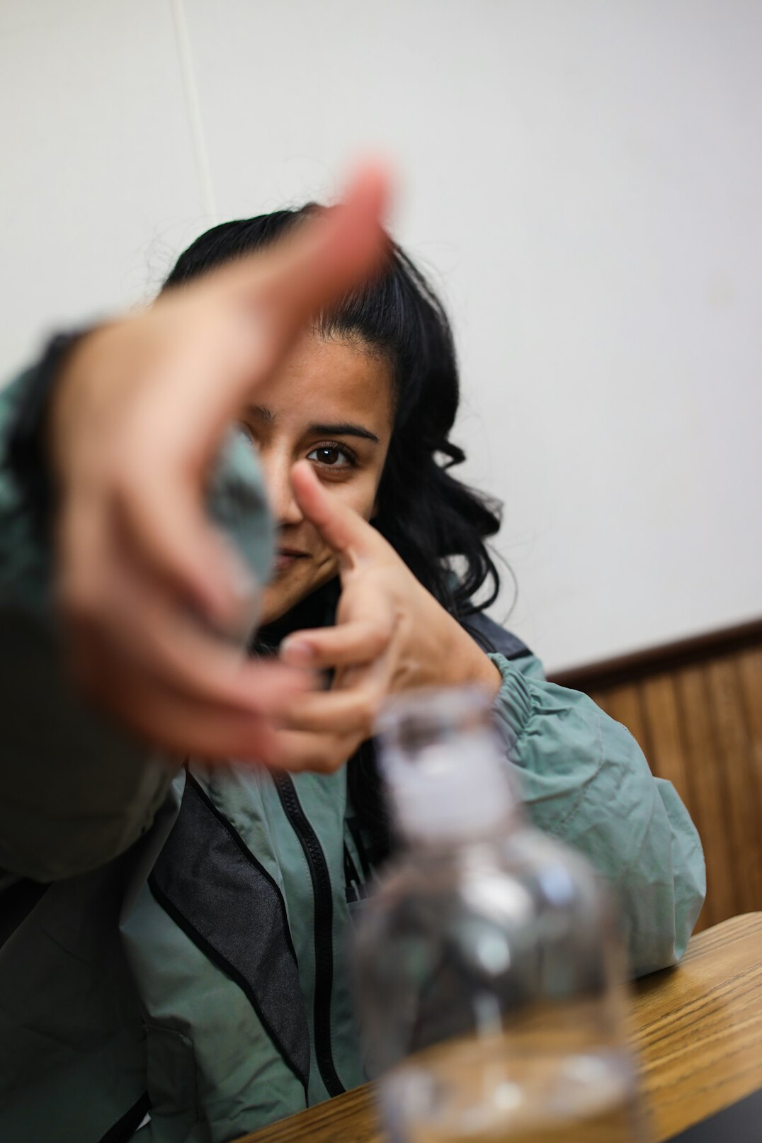 person drinking water at desk