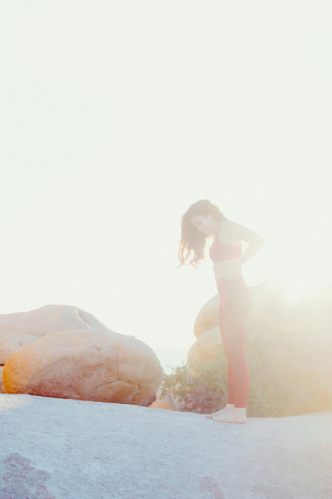 Woman doing yoga stretching outdoors in the morning
