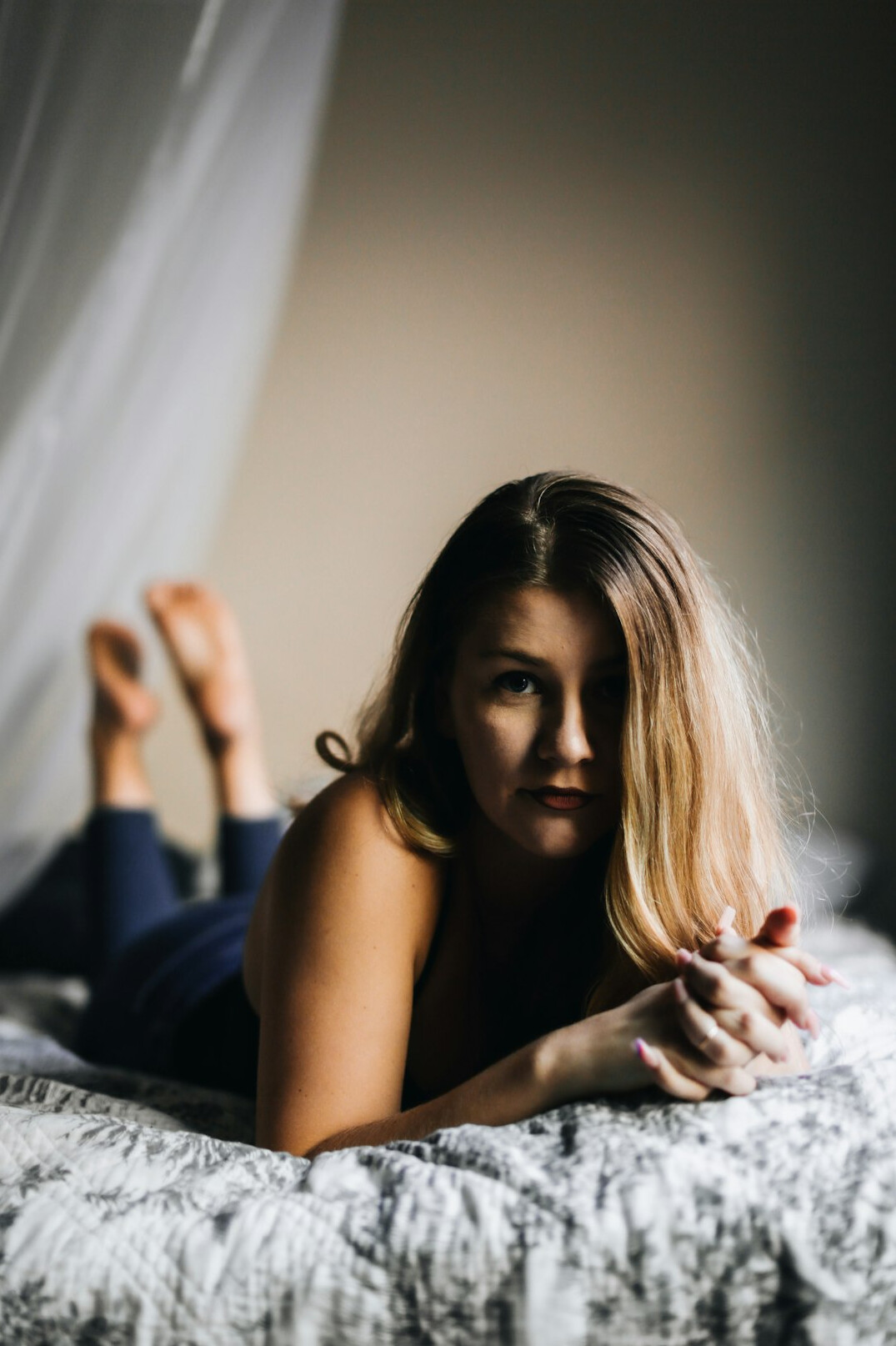 Woman meditating in a calm room with soft light