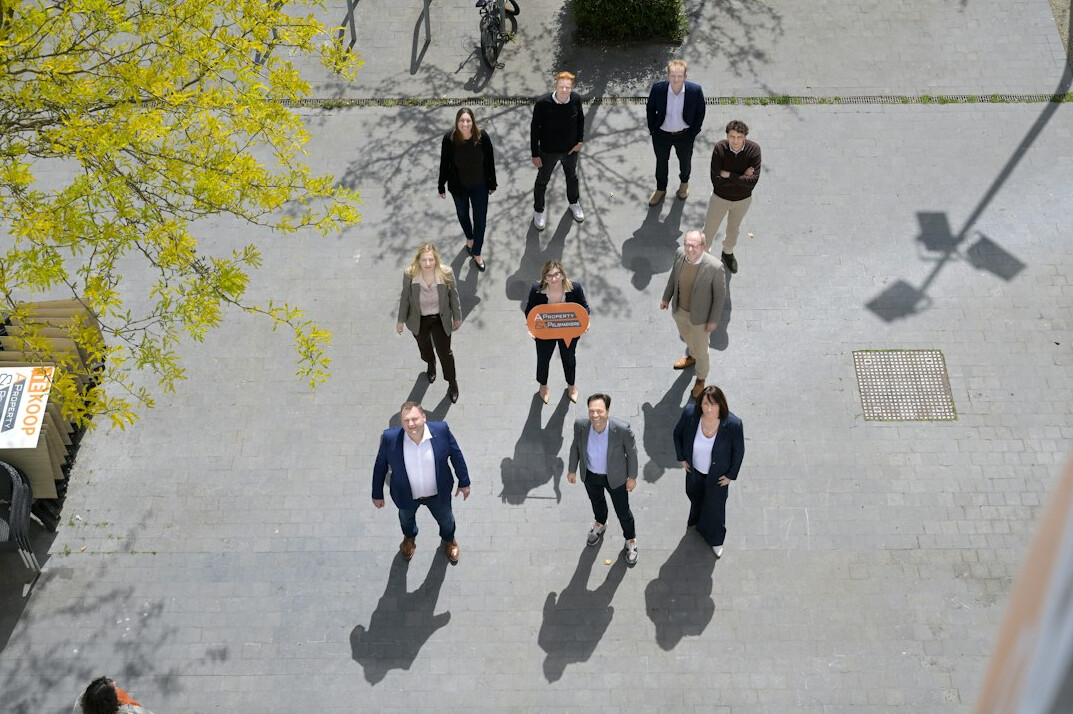 group of colleagues walking in office