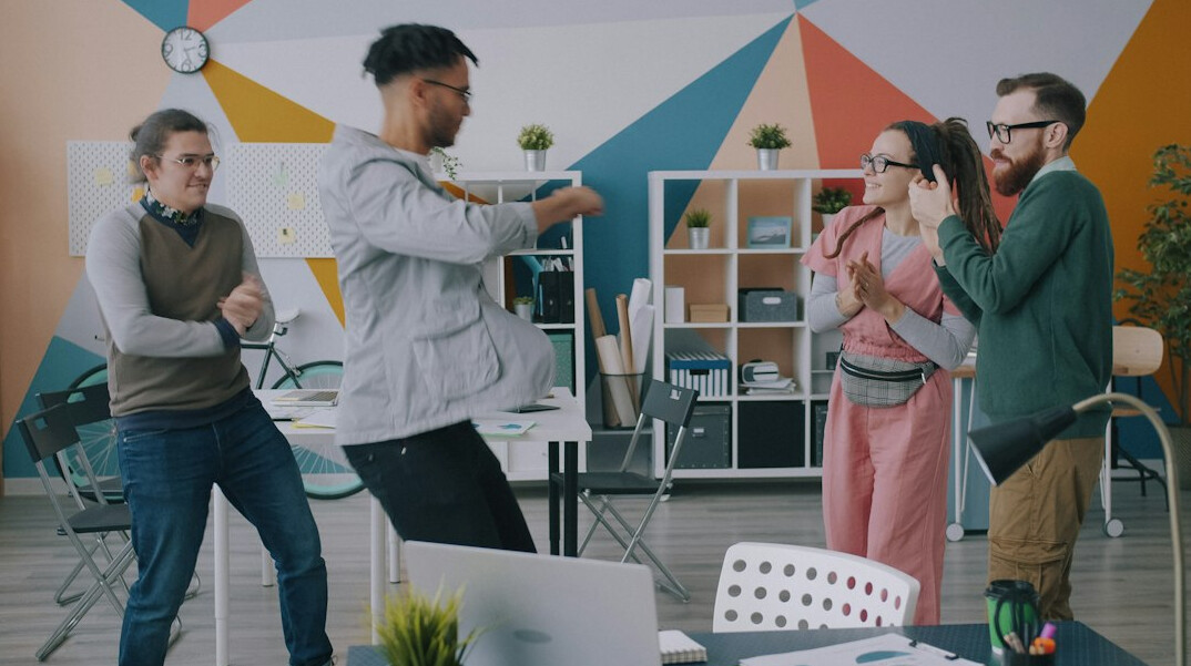 business team doing office stretches